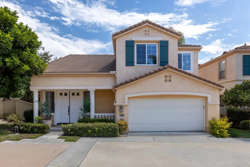 Front exterior of 5353 Renaissance Ave, an updated two-story home for sale in the gated Toscana community of Renaissance La Jolla, San Diego 92122