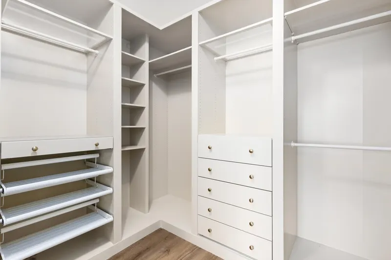 Walk-in closet with built-in shelving, drawers and hanging space at 5353 Renaissance Ave San Diego