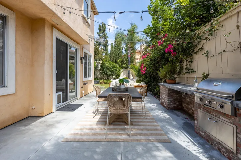 Built-in stainless barbecue and brick counter on the backyard patio at 5353 Renaissance Ave San Diego