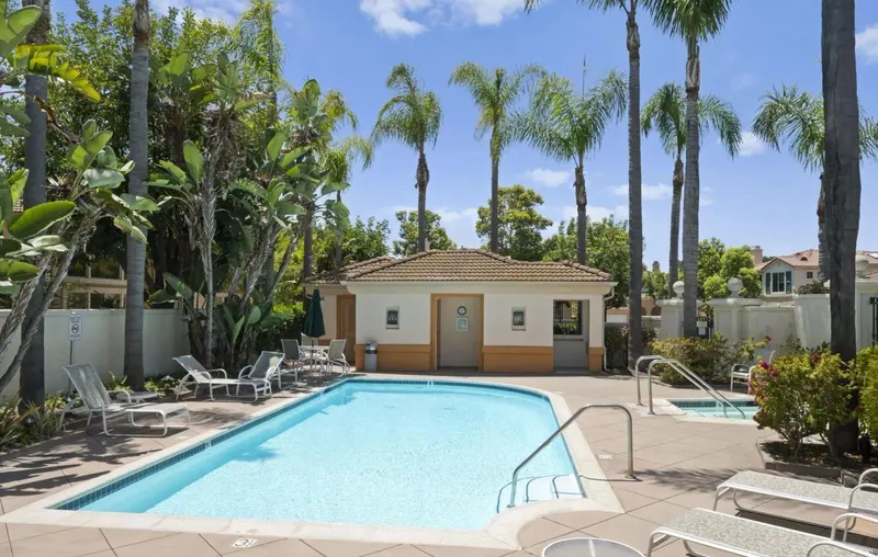 Toscana community pool and spa surrounded by palms at Renaissance La Jolla, San Diego 92122