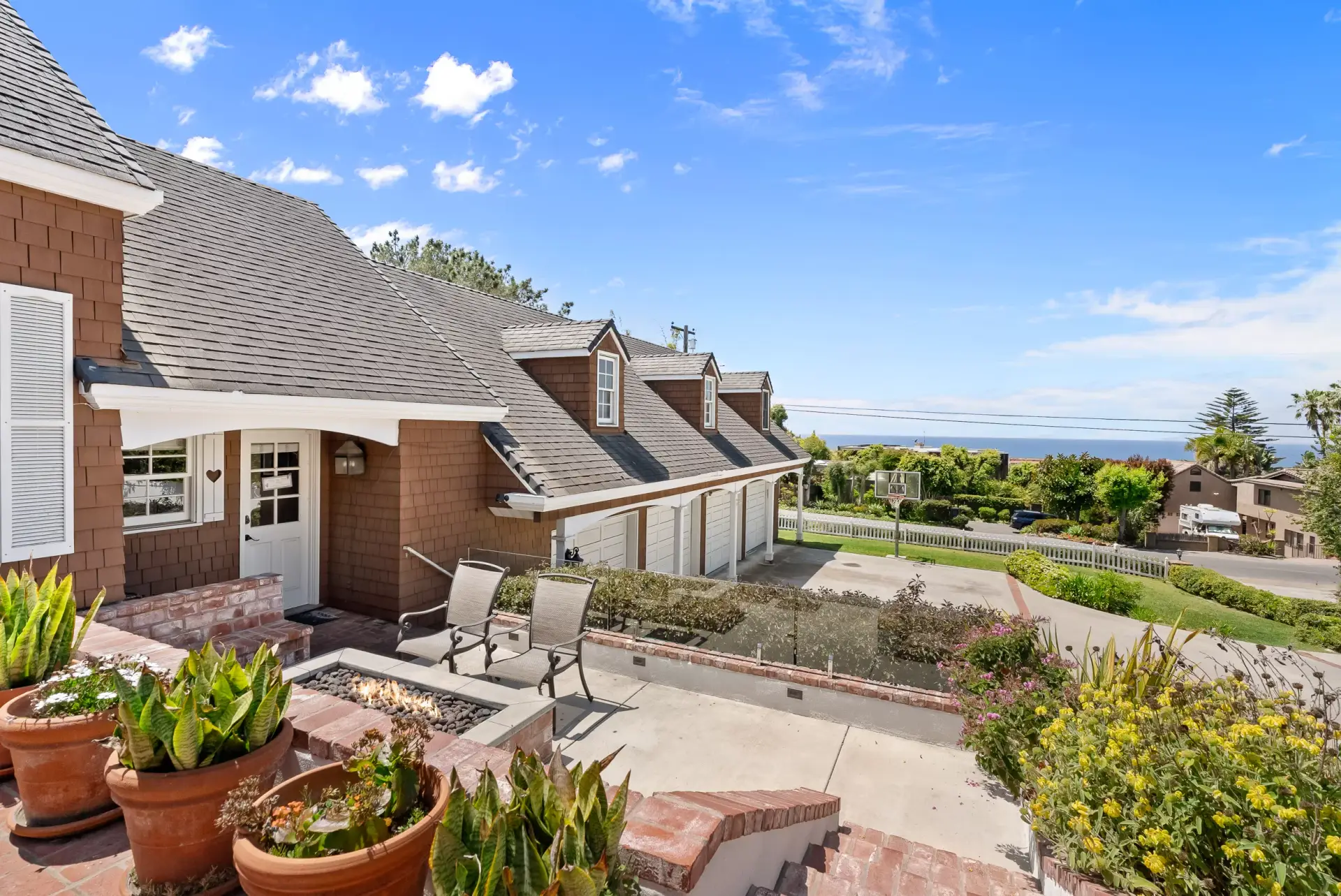 Ocean view terrace with a fire pit at a Solana Beach home