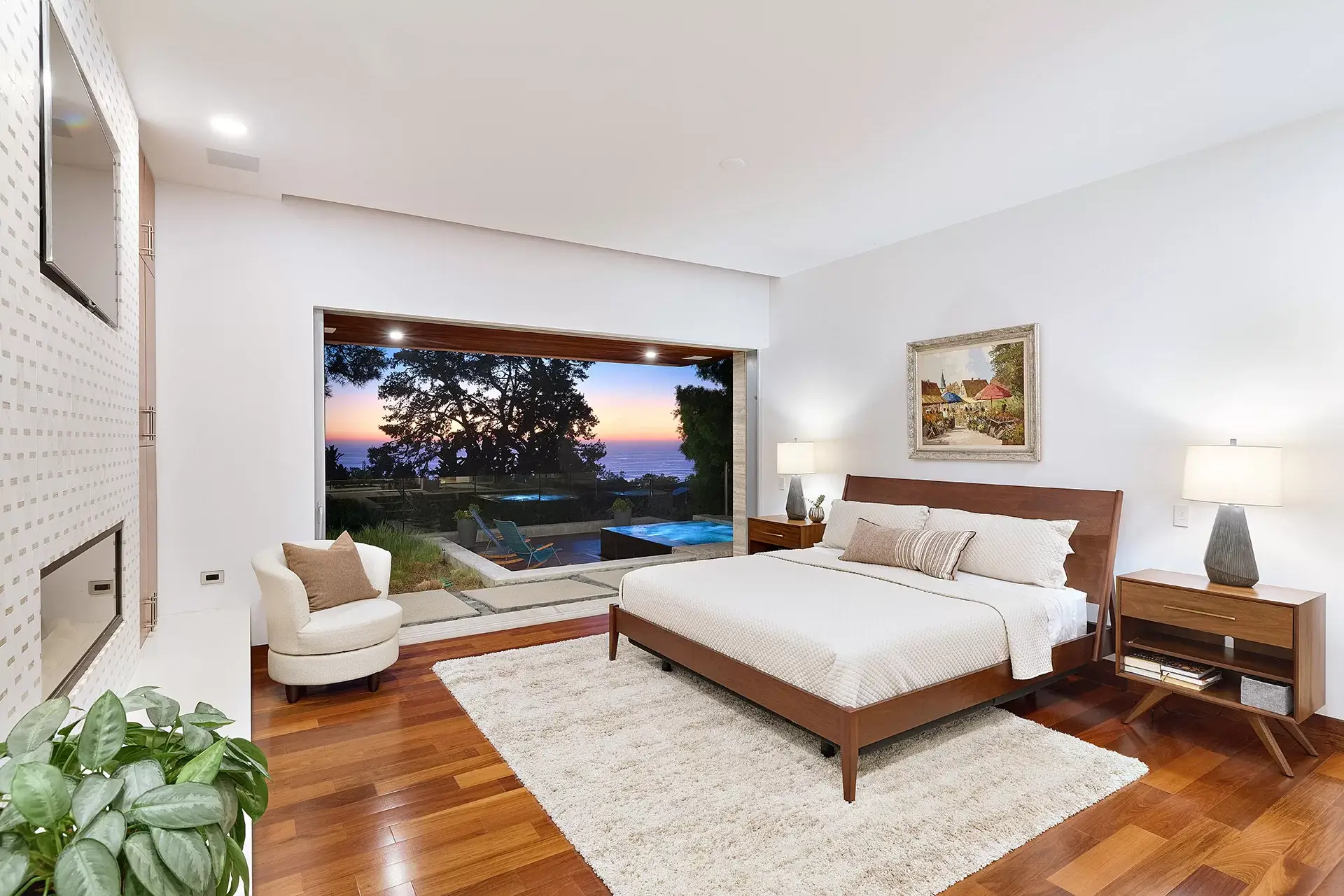 Primary suite with tall glass doors and ocean view deck at 116 Nob Ave Del Mar luxury home listed by Kelli Miller Compass