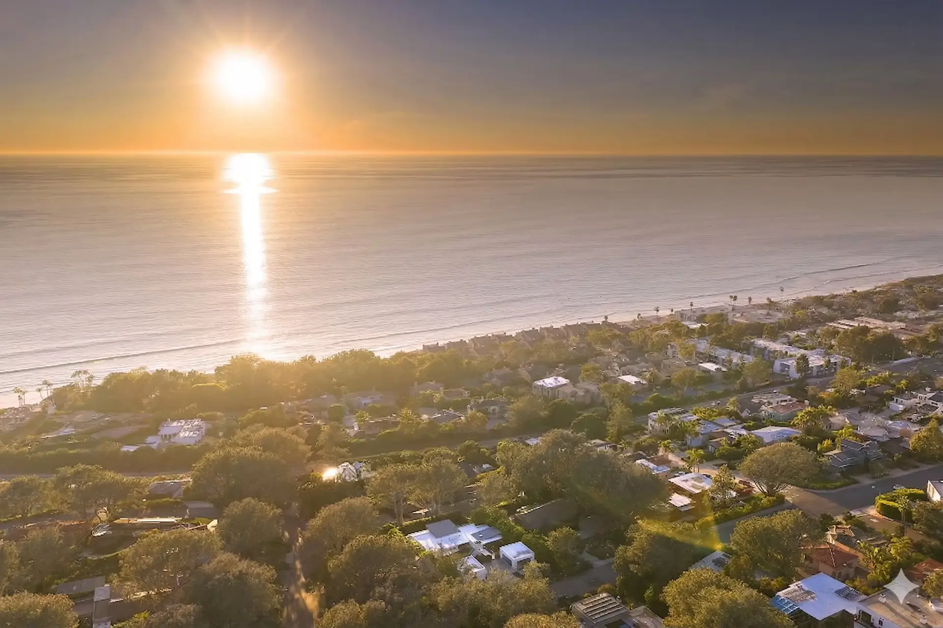 Aerial drone view of Olde Del Mar neighborhood and Pacific Ocean at golden hour showing location of 116 Nob Ave luxury home listed by Kelli Miller Compass