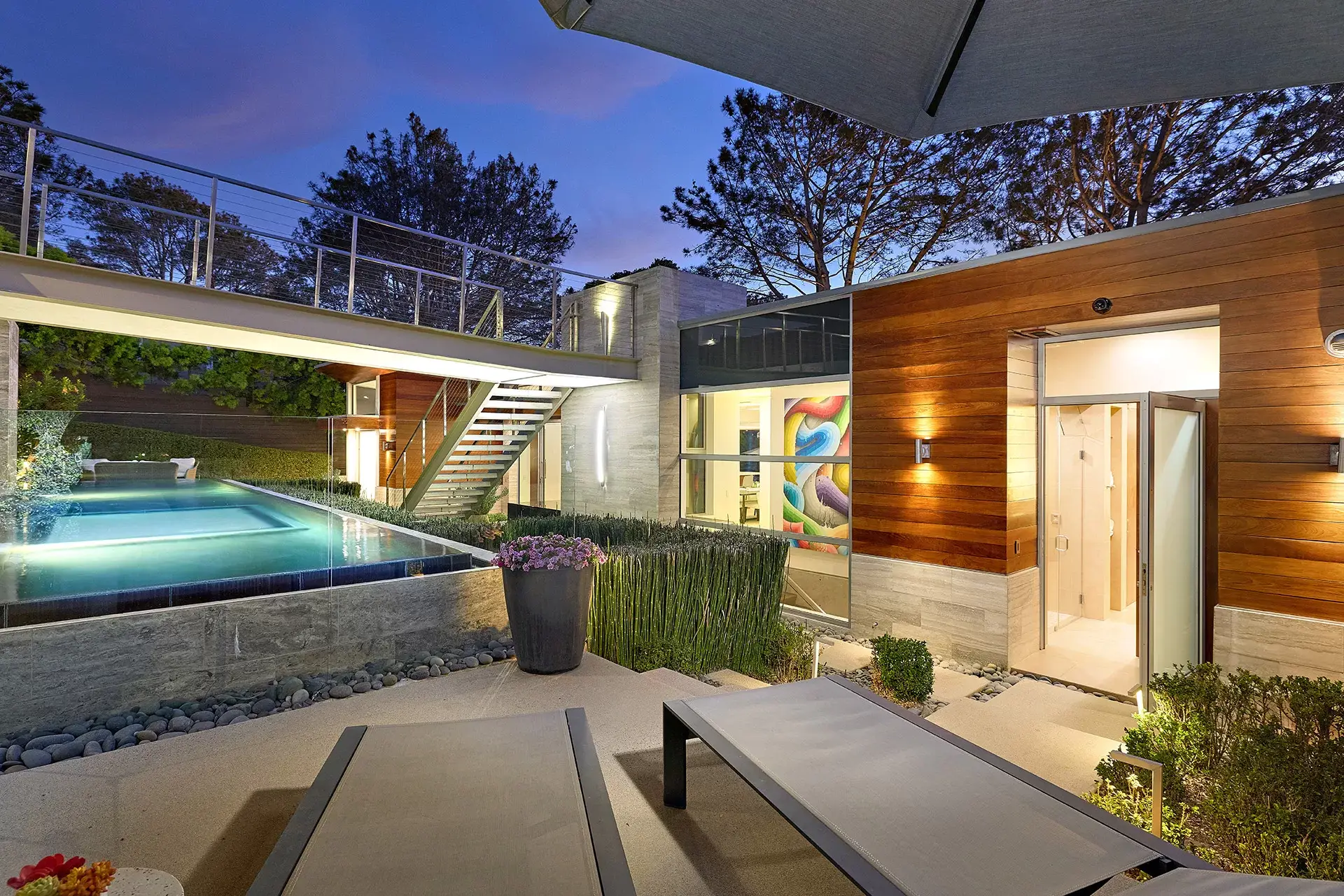 Infinity edge pool with lounge chairs and redwood facade at 116 Nob Ave Del Mar private luxury home listed by Kelli Miller Compass