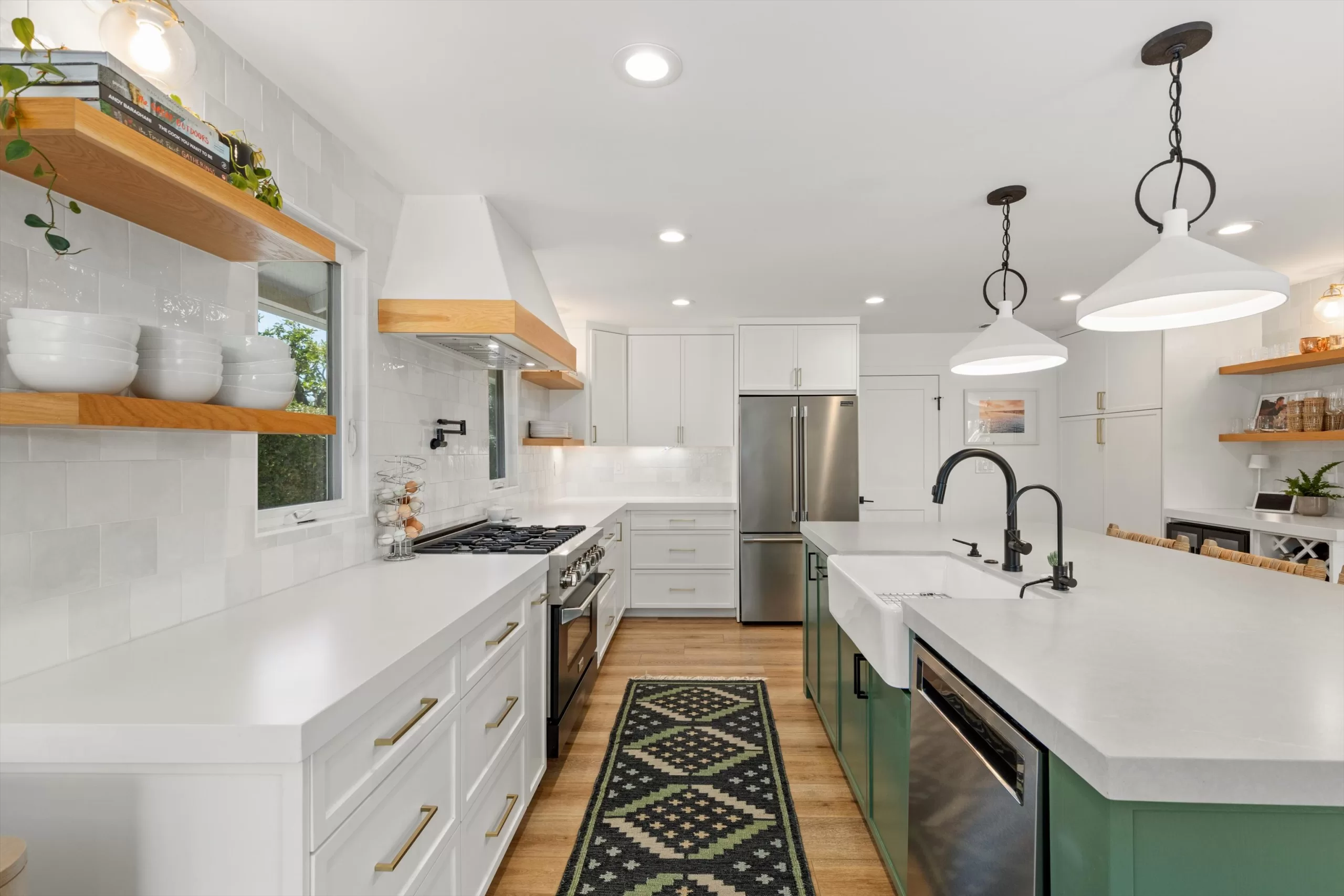 Reimagined kitchen with nine-foot island and gas range at 1063 San Julian Dr San Marcos listed by Kelli Miller Compass