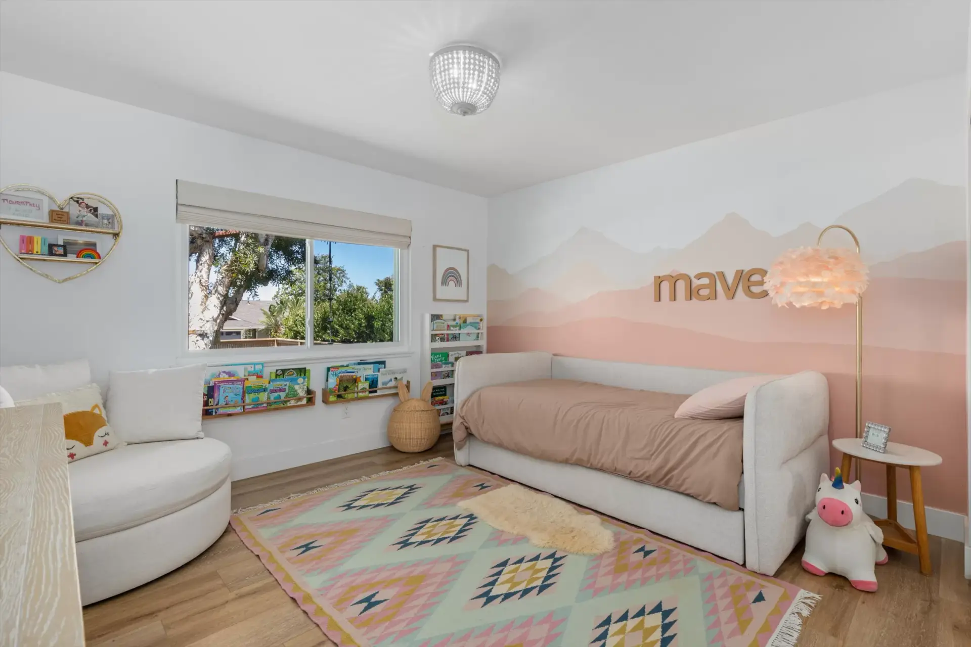 Guest bedroom with daybed and mountain mural accent wall at 1063 San Julian Dr San Marcos listed by Kelli Miller Compass