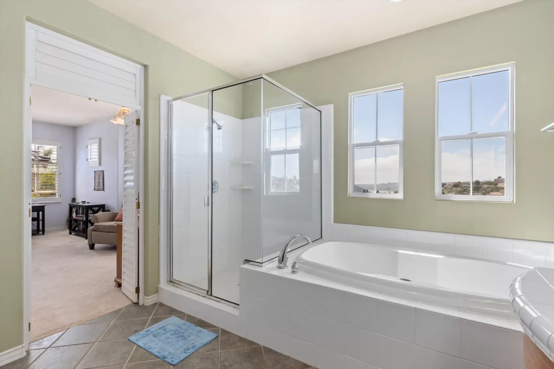 Primary suite bathroom with walk-in closet at 2198 Vista La Nisa Carlsbad listed by Kelli Miller Compass