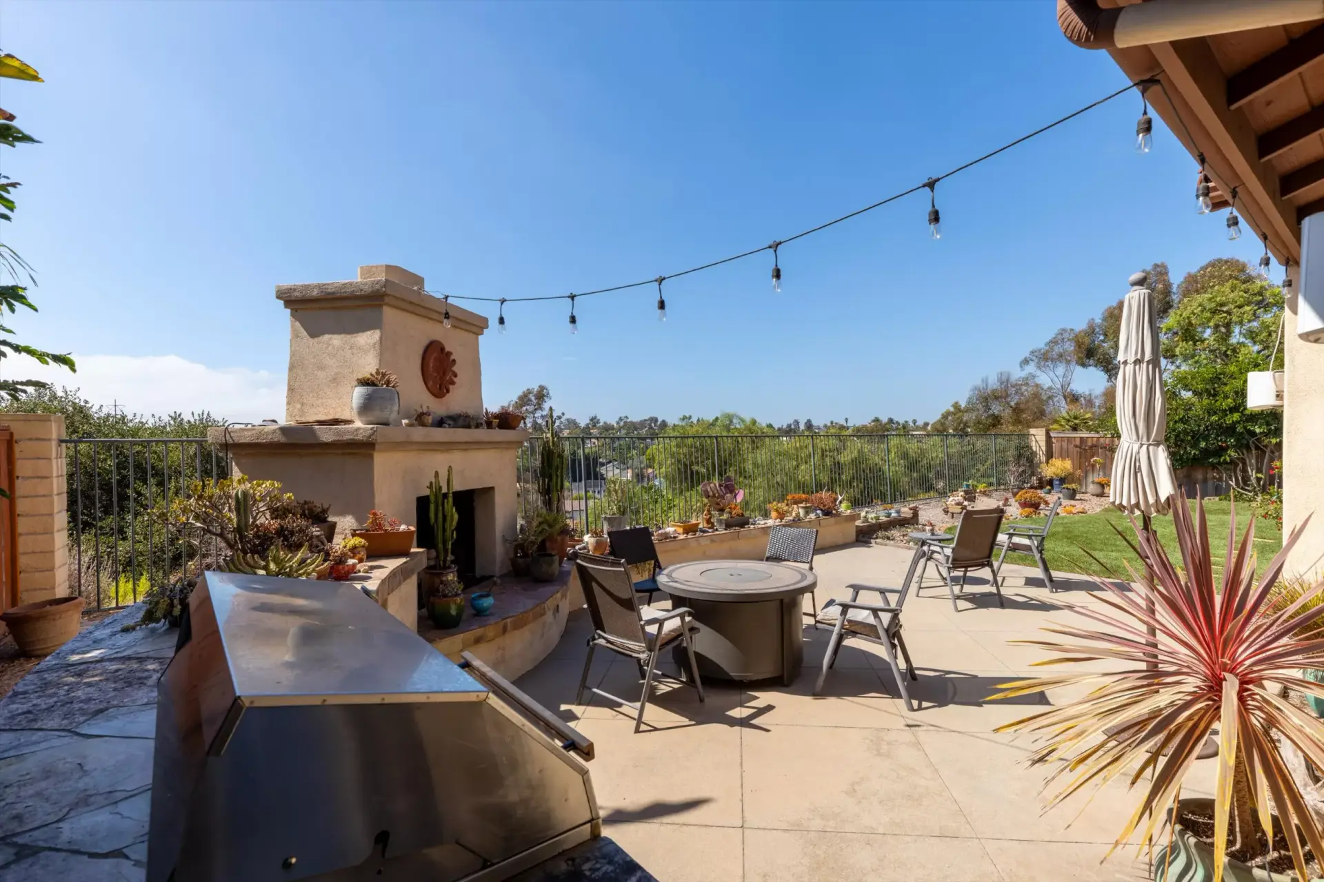 Rear patio built-in BBQ and dining area at 2198 Vista La Nisa Carlsbad listed by Kelli Miller Compass