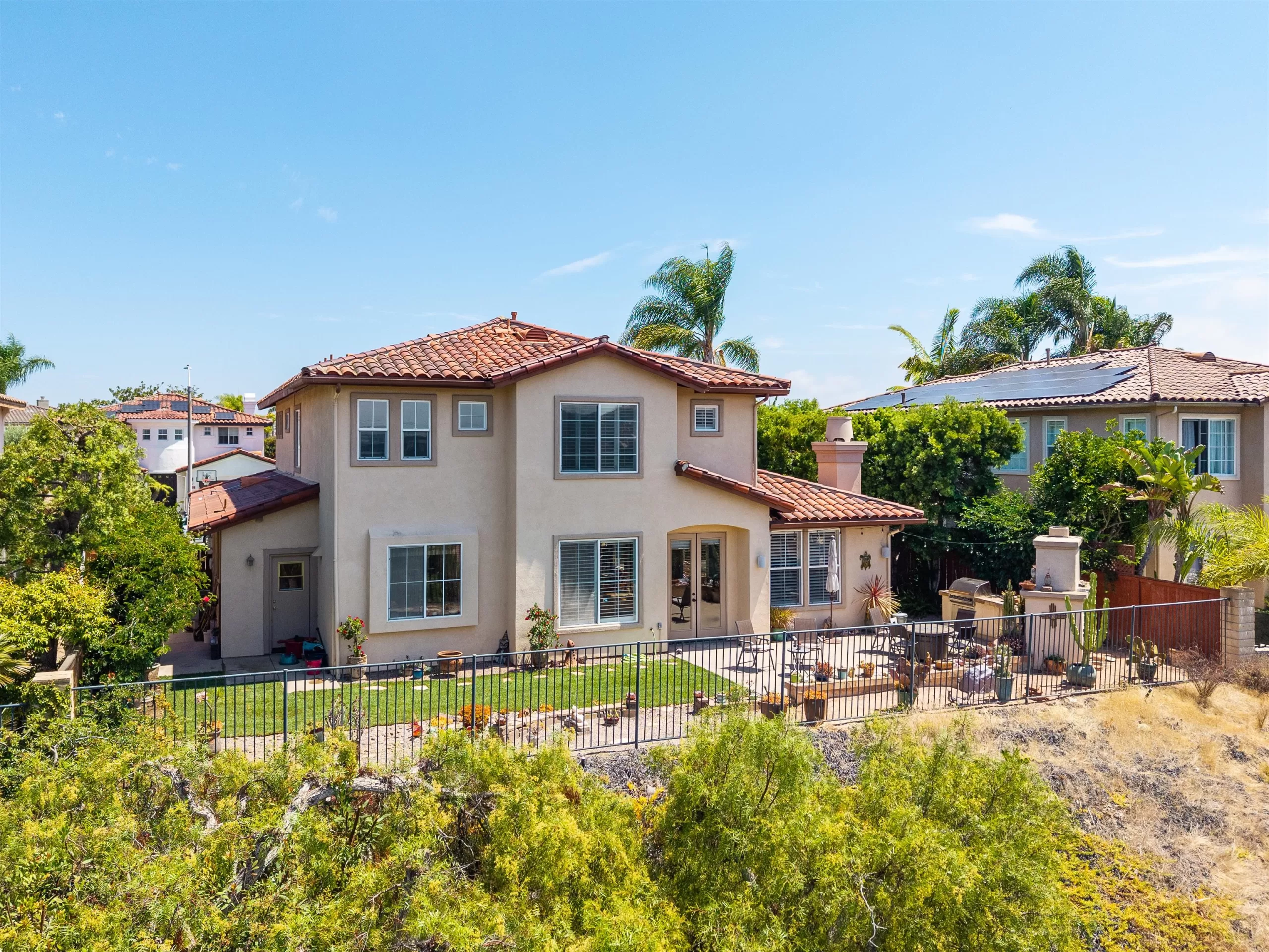 Pulled-back aerial view of the backyard at 2198 Vista La Nisa Carlsbad listed by Kelli Miller Compass