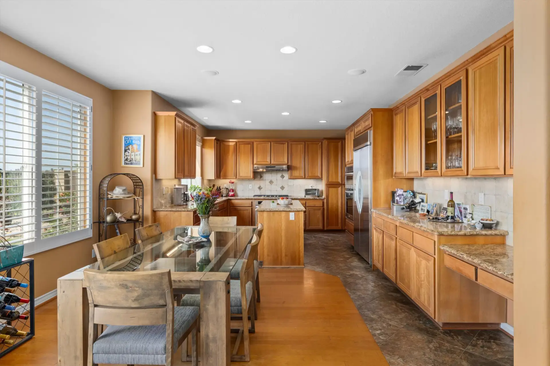 Kitchen with wood cabinetry and granite counters at 2198 Vista La Nisa Carlsbad listed by Kelli Miller Compass