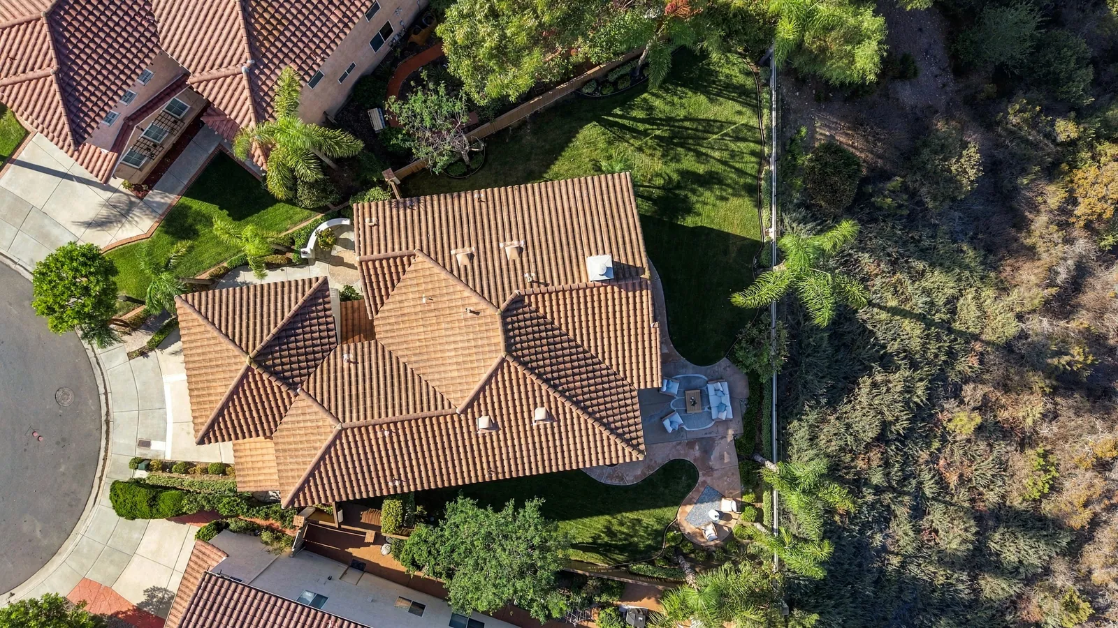 Overhead aerial of the lot showing the cul-de-sac frontage, patio, lawns and the canyon behind at 12086 Little Silver Ct, Scripps Ranch, San Diego