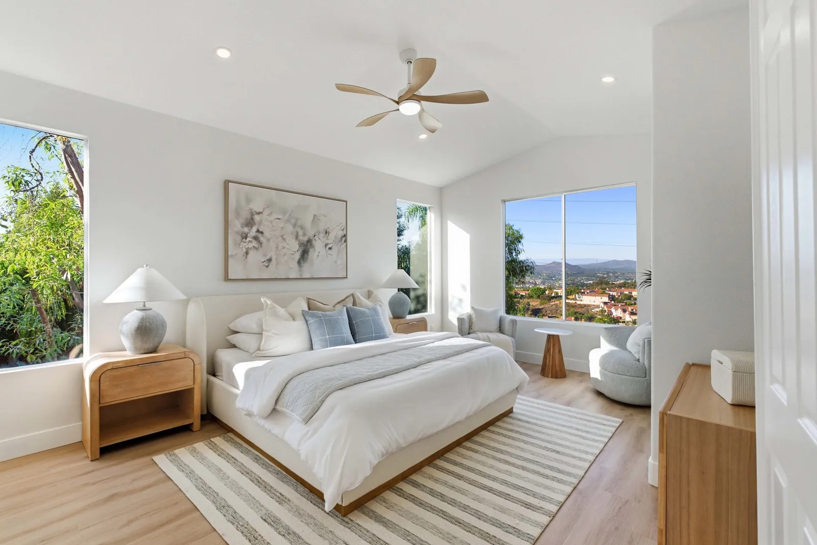Primary bedroom with vaulted ceiling and an oversized picture window facing the canyon at 12086 Little Silver Ct, Scripps Ranch, San Diego
