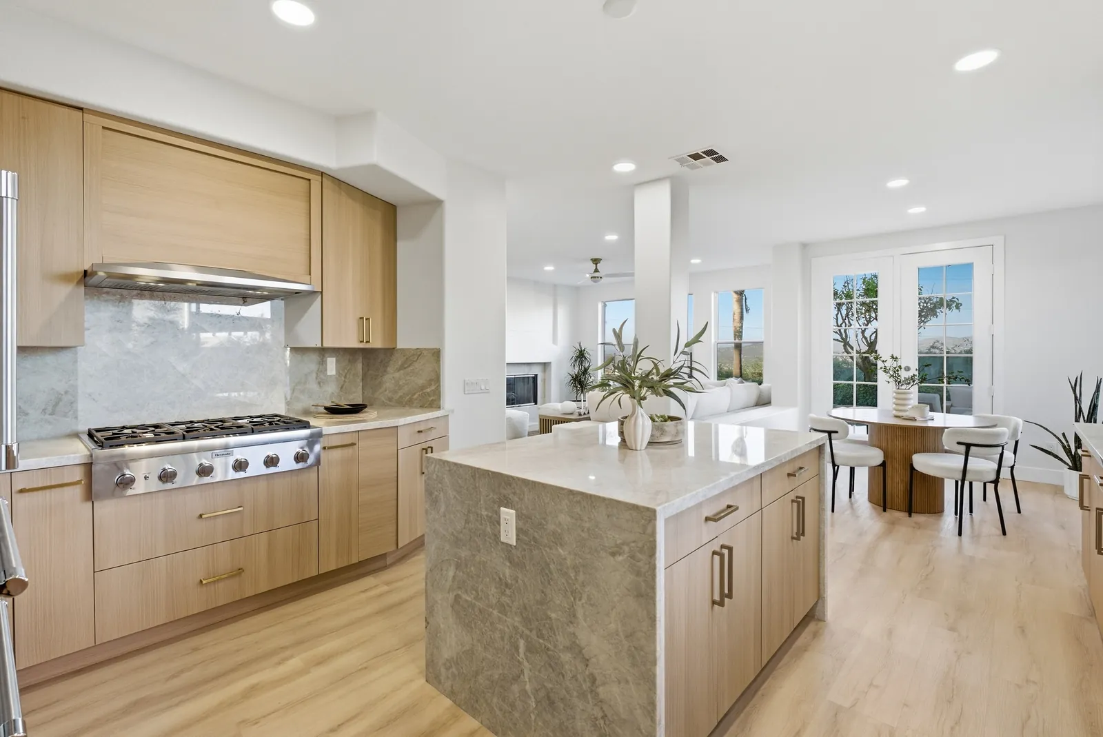 Kitchen island looking toward the breakfast nook and French doors to the backyard at 12086 Little Silver Ct, Scripps Ranch, San Diego