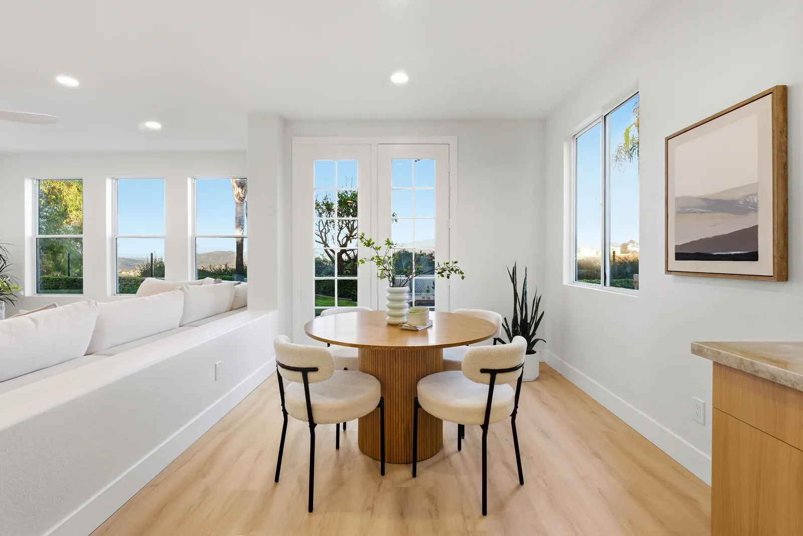 Breakfast nook with round table, window seat and French doors to the yard at 12086 Little Silver Ct, Scripps Ranch, San Diego