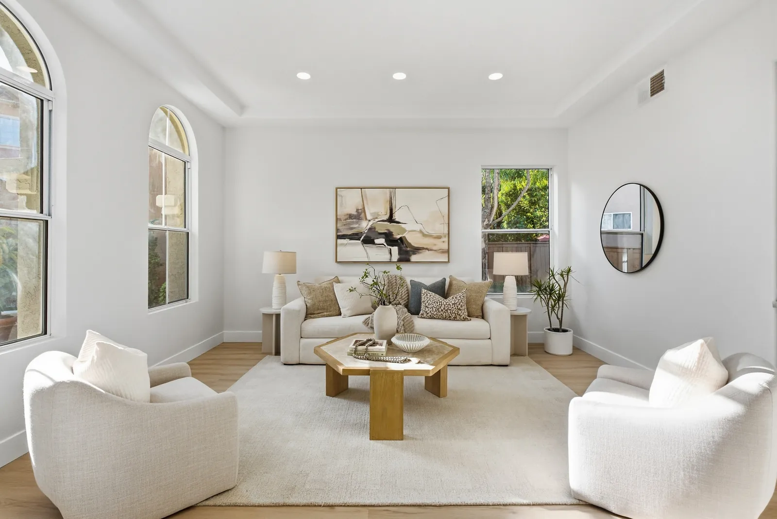 Living room with arched windows and recessed lighting at 12086 Little Silver Ct, Scripps Ranch, San Diego