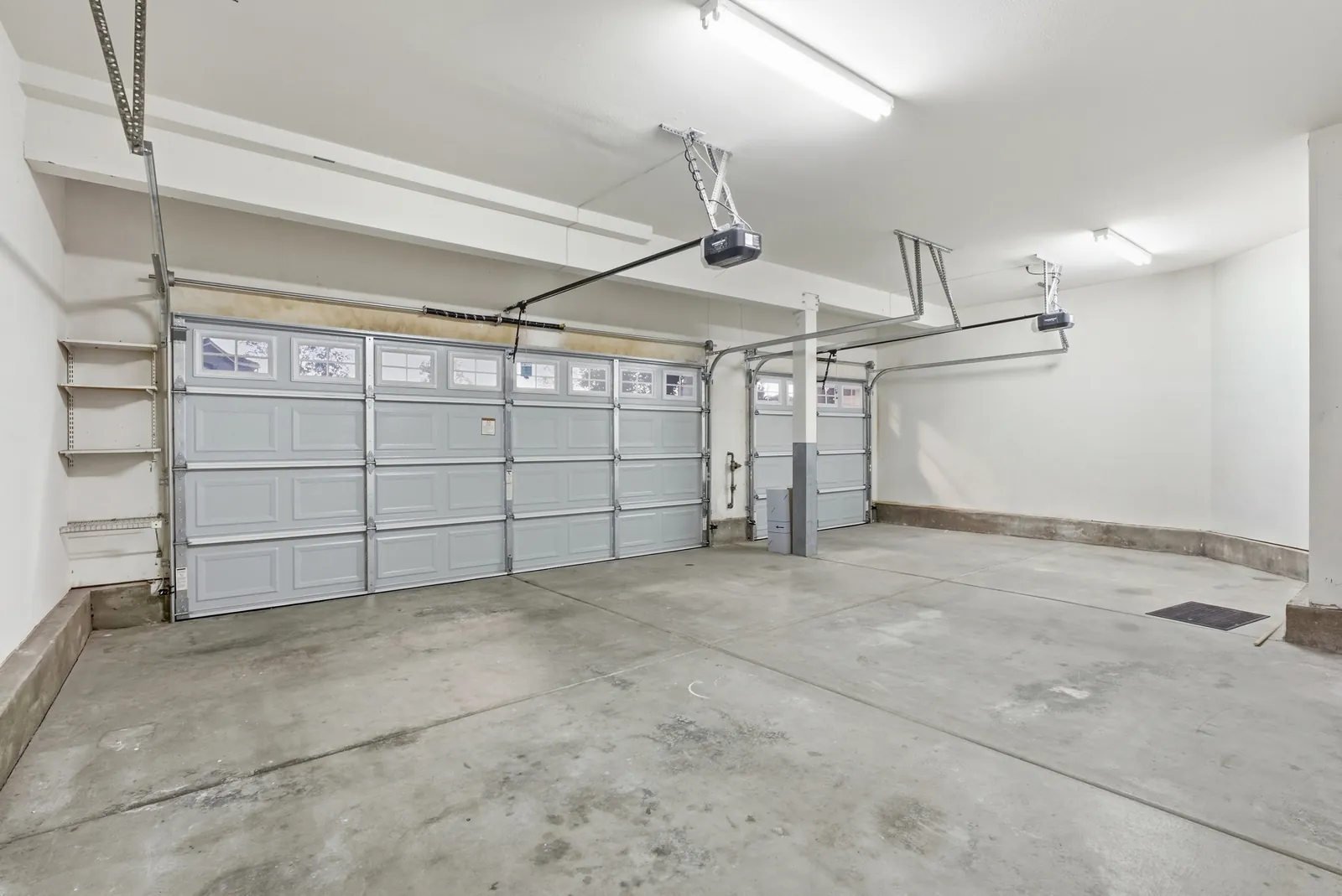 Attached three-car garage with two roll-up doors at 12086 Little Silver Ct, Scripps Ranch, San Diego