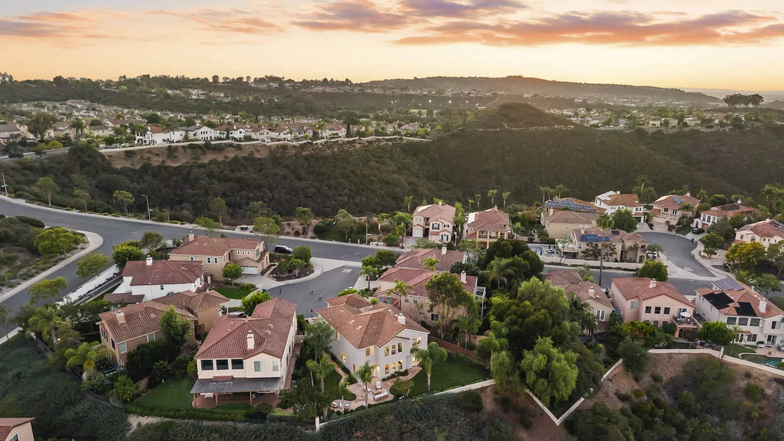 Twilight aerial of the cul-de-sac and the canyon behind it at 12086 Little Silver Ct, Scripps Ranch, San Diego