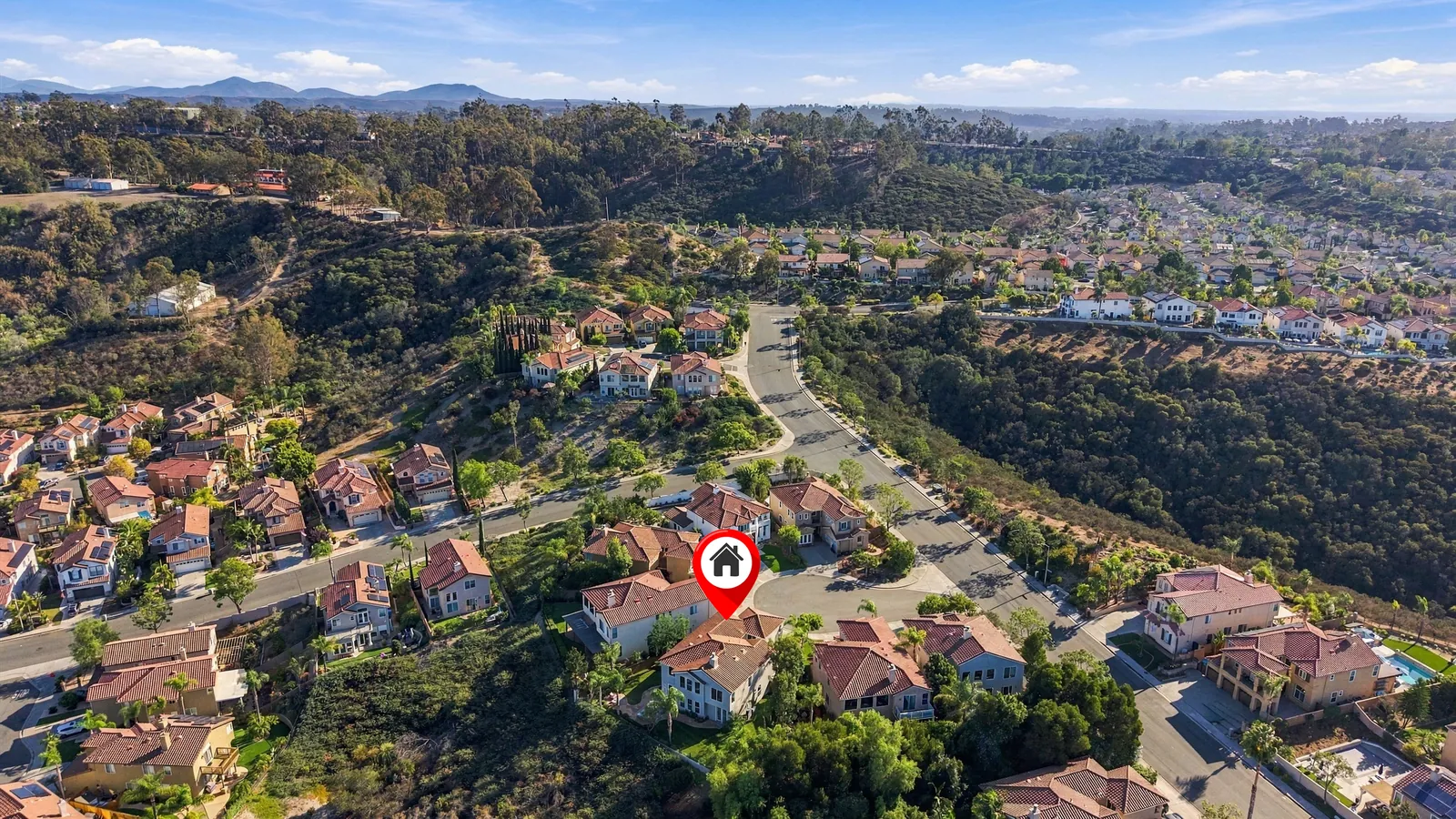 Aerial of the neighborhood with the home marked beside the open canyon at 12086 Little Silver Ct, Scripps Ranch, San Diego